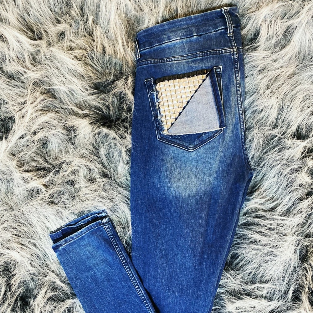 Custom designed blue jeans with rocker studded back pocket